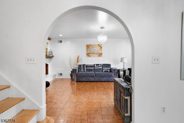 Chandelier, Fireplace, Interior, Living room, Recessed Lighting, Wood Texture Flooring