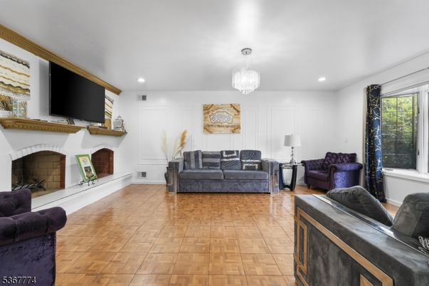Chandelier, Fireplace, Interior, Living room, Recessed Lighting, Wood Texture Flooring