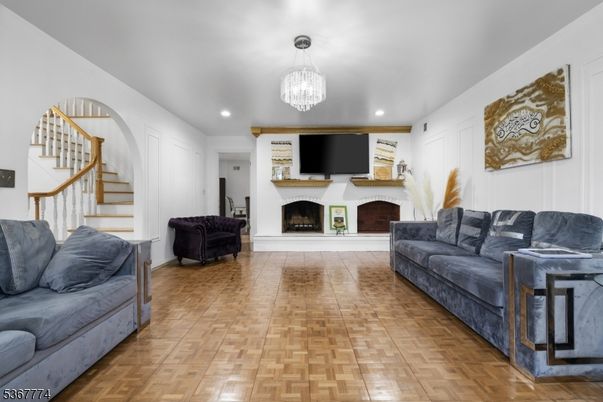 Chandelier, Fireplace, Interior, Living room, Recessed Lighting, Wood Texture Flooring