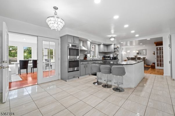 Chandelier, Interior, Kitchen, Living room, Recessed Lighting, Stainless Steel Appliances, Wood Texture Flooring