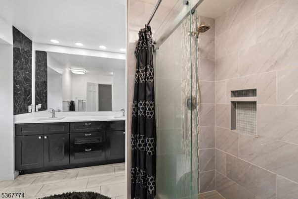 Bathroom, Dual Sink Vanities, Glass Shower, Interior, Marble, Recessed Lighting
