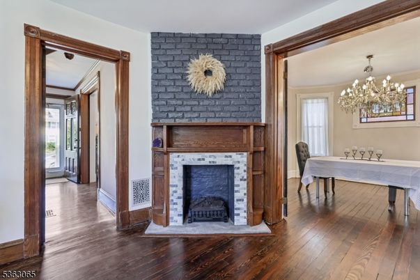 Chandelier, Dining room, Fireplace, Interior, Stone Walls, Wood Texture Flooring
