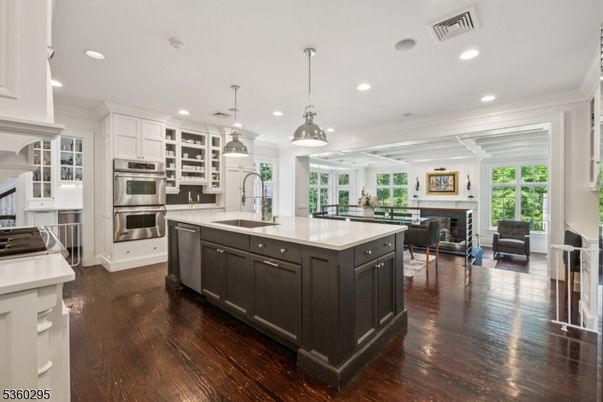 Dining room, Fireplace, Interior, Kitchen, Pendant Lights, Recessed Lighting, Stainless Steel Appliances, Wood Texture Flooring