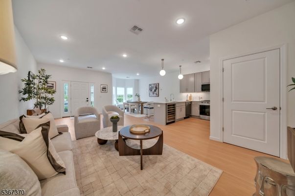 Dining room, Interior, Kitchen, Living room, Pendant Lights, Recessed Lighting, Stainless Steel Appliances, Wood Texture Flooring