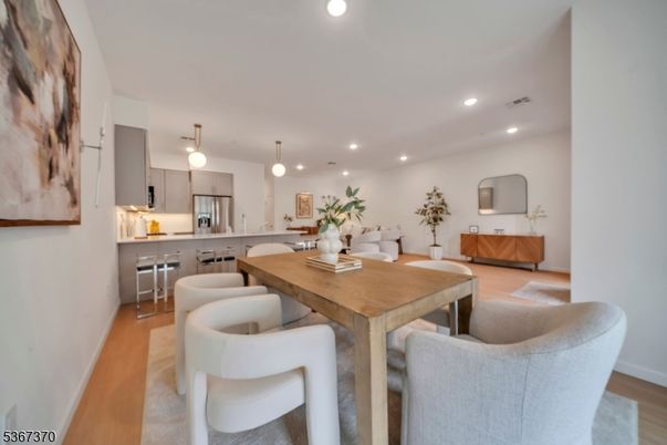 Dining room, Interior, Kitchen, Living room, Pendant Lights, Recessed Lighting, Stainless Steel Appliances, Wood Texture Flooring
