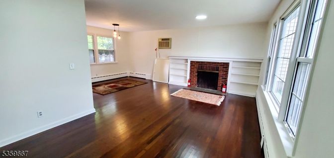 Empty room, Fireplace, Interior, Pendant Lights, Recessed Lighting, Wood Texture Flooring