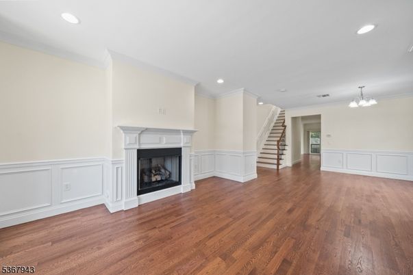 Chandelier, Empty room, Fireplace, Interior, Recessed Lighting, Wood Texture Flooring