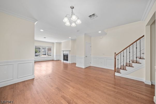 Chandelier, Empty room, Fireplace, Interior, Recessed Lighting, Wood Texture Flooring