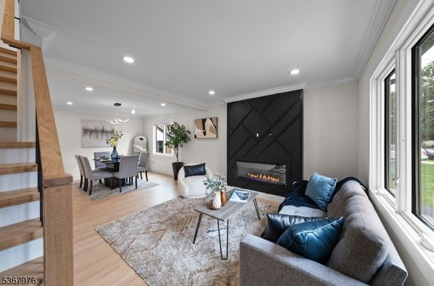 Dining room, Fireplace, Interior, Living room, Pendant Lights, Recessed Lighting, Wood Texture Flooring