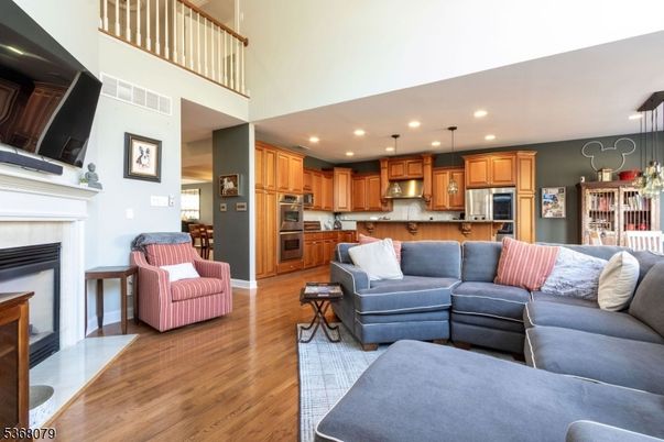 Dining room, Fireplace, Interior, Kitchen, Living room, Pendant Lights, Recessed Lighting, Stainless Steel Appliances, Wood Texture Flooring