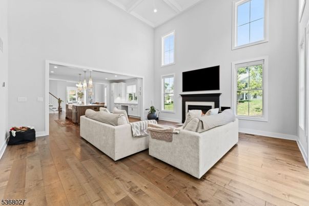 Chandelier, Fireplace, Interior, Living room, Pendant Lights, Recessed Lighting, Wood Texture Flooring