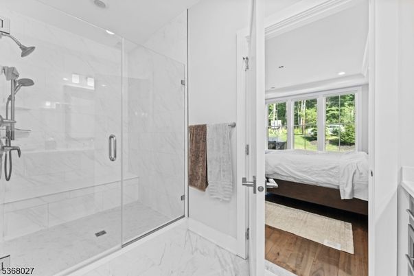 Bathroom, Bedroom, Glass Shower, Interior, Marble, Marble Walls, Recessed Lighting, Wood Texture Flooring