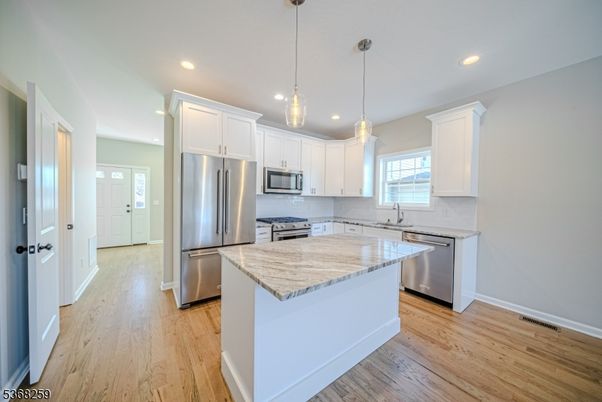 Interior, Kitchen, Pendant Lights, Recessed Lighting, Stainless Steel Appliances, Wood Texture Flooring