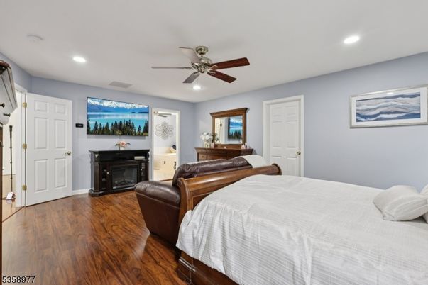 Bedroom, Fireplace, Interior, Recessed Lighting, Water, Wood Texture Flooring