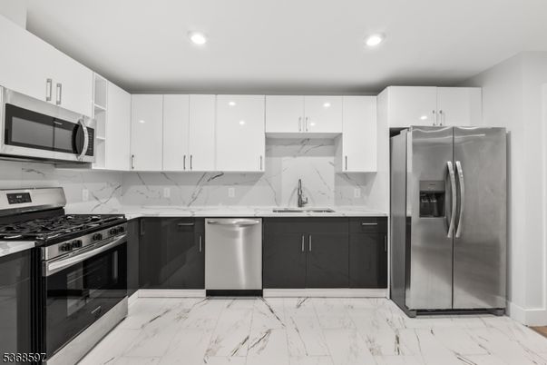 Interior, Kitchen, Marble, Marble Walls, Recessed Lighting, Stainless Steel Appliances