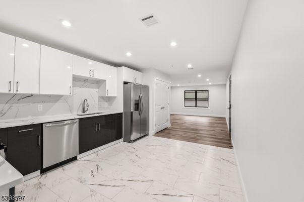Interior, Kitchen, Marble, Marble Walls, Recessed Lighting, Stainless Steel Appliances, Wood Texture Flooring