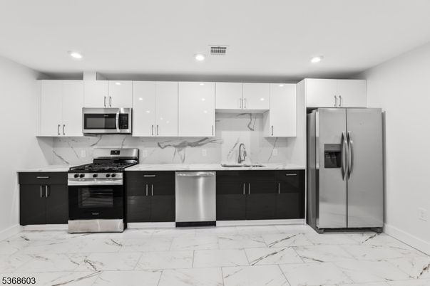 Interior, Kitchen, Marble, Marble Walls, Recessed Lighting, Stainless Steel Appliances