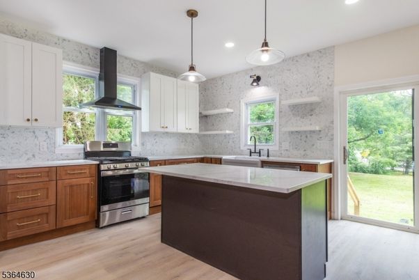 Interior, Kitchen, Marble Walls, Pendant Lights, Recessed Lighting, Stainless Steel Appliances, Wood Texture Flooring