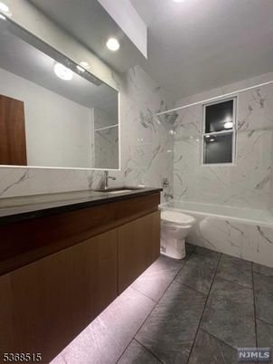 Bathroom, Dual Sink Vanities, Interior, Marble Walls, Recessed Lighting