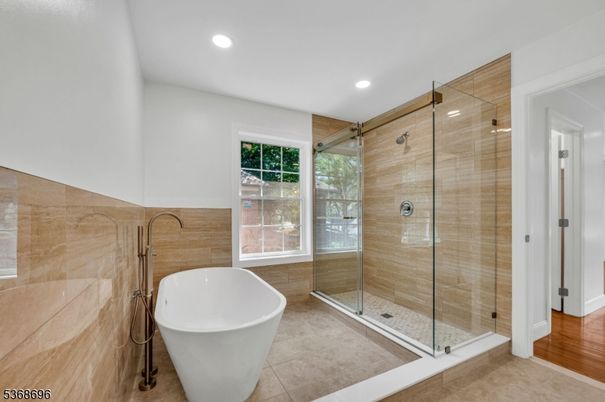 Bathroom, Free Standing Baths, Glass Shower, Interior, Recessed Lighting, Wood Texture Flooring