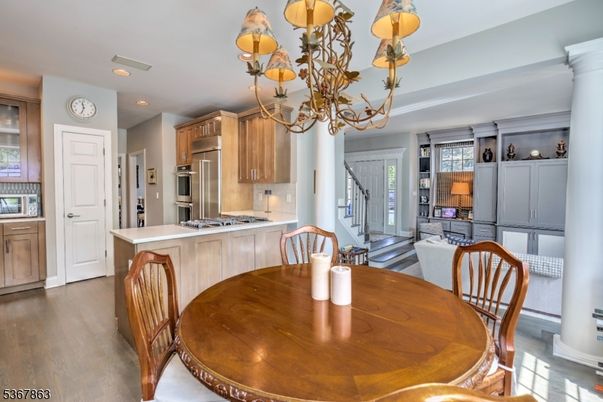 Chandelier, Dining room, Interior, Kitchen, Recessed Lighting, Stainless Steel Appliances, Wood Texture Flooring