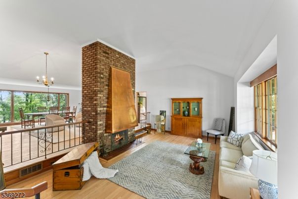Chandelier, Dining room, Fireplace, Interior, Living room, Pendant Lights, Wood Texture Flooring