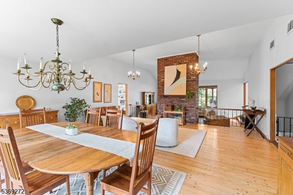 Chandelier, Dining room, Fireplace, Interior, Living room, Stone Walls, Wood Texture Flooring