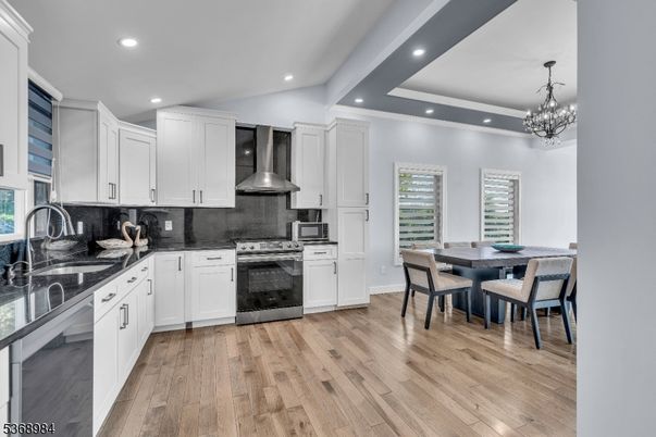 Chandelier, Dining room, Interior, Kitchen, Recessed Lighting, Stainless Steel Appliances, Wood Texture Flooring