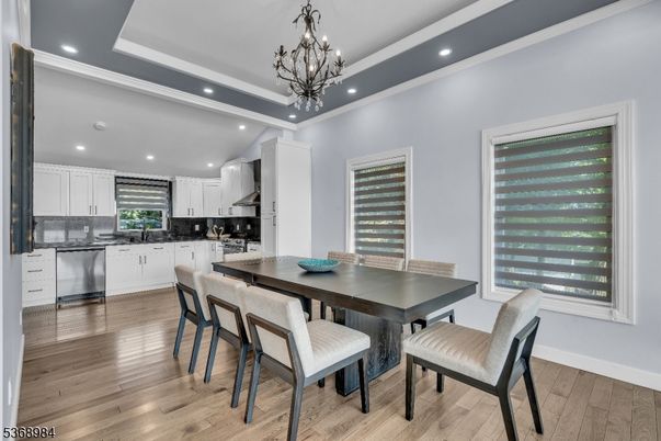 Chandelier, Dining room, Interior, Kitchen, Pendant Lights, Recessed Lighting, Stainless Steel Appliances, Wood Texture Flooring