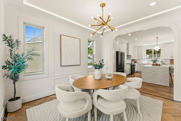 Dining room, Interior, Kitchen, Marble Walls, Pendant Lights, Recessed Lighting, Stainless Steel Appliances, Wood Texture Flooring