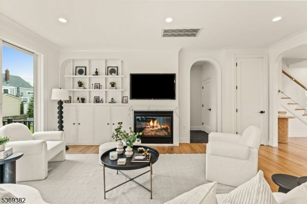 Fireplace, Interior, Living room, Recessed Lighting, Wood Texture Flooring