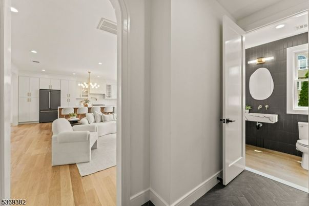 Bathroom, Chandelier, Dining room, Interior, Kitchen, Living room, Pendant Lights, Recessed Lighting, Wood Texture Flooring
