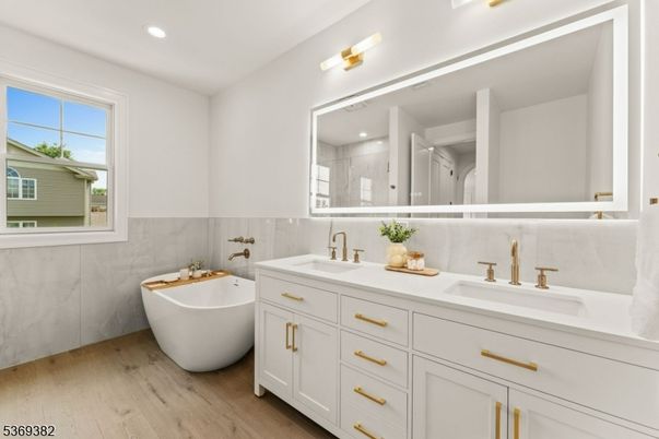 Bathroom, Dual Sink Vanities, Free Standing Baths, Interior, Recessed Lighting, Wood Texture Flooring