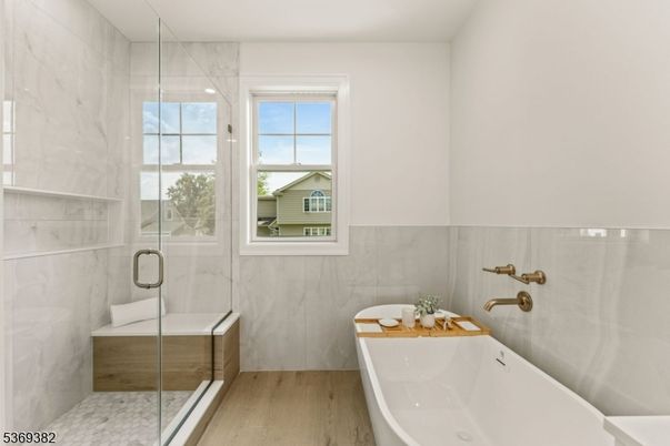 Bathroom, Glass Shower, Interior, Marble Walls, Wood Texture Flooring