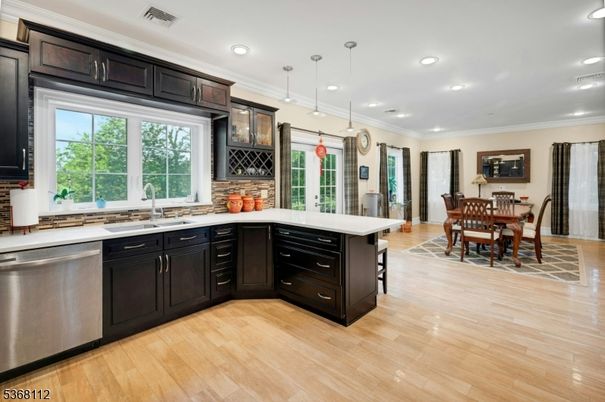 Dining room, Interior, Kitchen, Pendant Lights, Recessed Lighting, Stainless Steel Appliances, Wood Texture Flooring