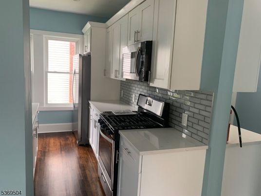 Interior, Kitchen, Tile Countertops, Wood Texture Flooring
