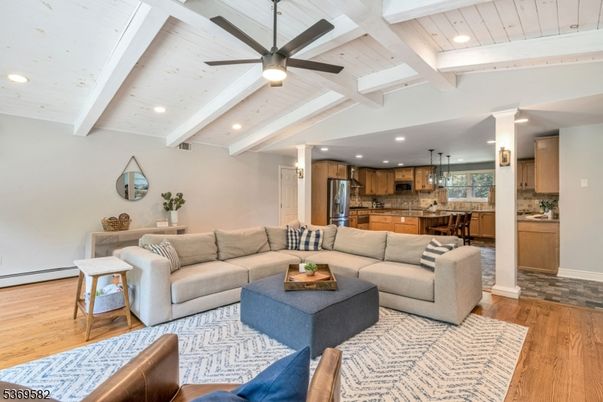 Chandelier, Interior, Kitchen, Living room, Pendant Lights, Recessed Lighting, Stainless Steel Appliances, Wood Texture Flooring