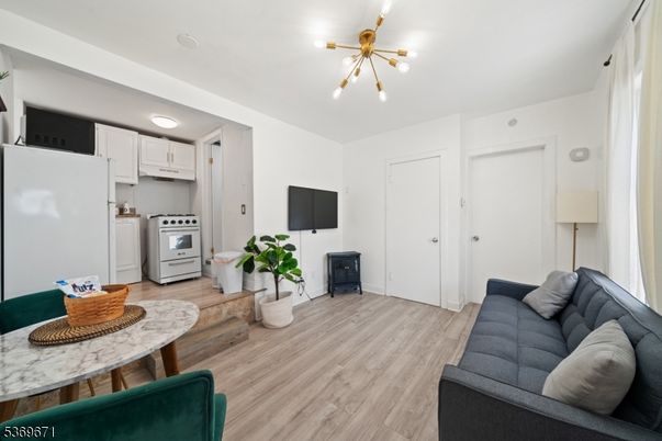 Interior, Kitchen, Pendant Lights, Washer, Wood Texture Flooring