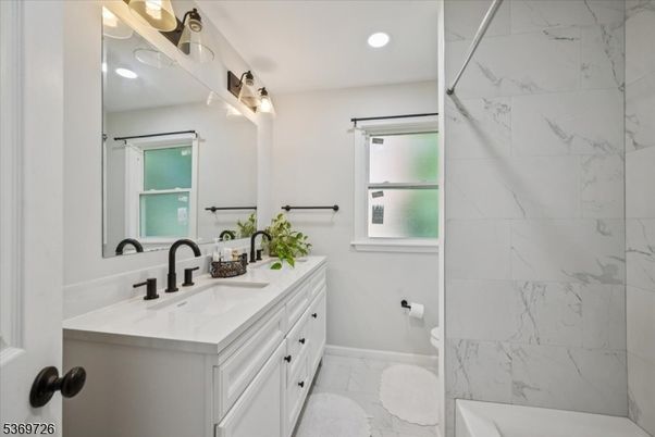 Bathroom, Dual Sink Vanities, Interior, Marble, Marble Walls, Recessed Lighting