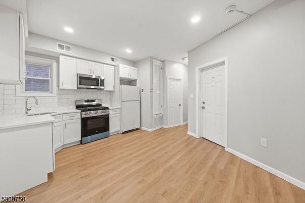 Interior, Kitchen, Recessed Lighting, Stainless Steel Appliances, Wood Texture Flooring