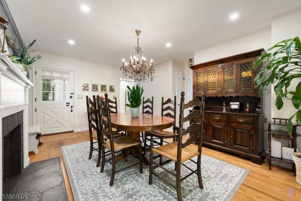 Chandelier, Dining room, Fireplace, Interior, Recessed Lighting, Wood Texture Flooring