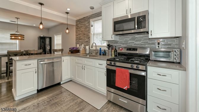 Dining room, Interior, Kitchen, Pendant Lights, Recessed Lighting, Stainless Steel Appliances, Wood Texture Flooring