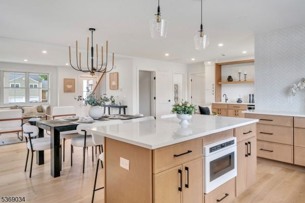 Dining room, Interior, Kitchen, Living room, Pendant Lights, Recessed Lighting, Stainless Steel Appliances, Wood Texture Flooring