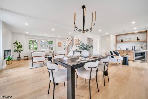 Dining room, Fireplace, Interior, Living room, Pendant Lights, Recessed Lighting, Wood Texture Flooring