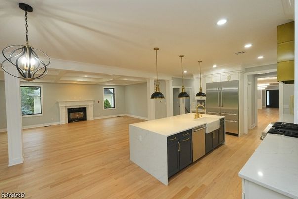 Fireplace, Interior, Kitchen, Pendant Lights, Recessed Lighting, Stainless Steel Appliances, Wood Texture Flooring