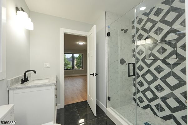 Bathroom, Glass Shower, Interior, Marble Walls, Recessed Lighting, Wood Texture Flooring