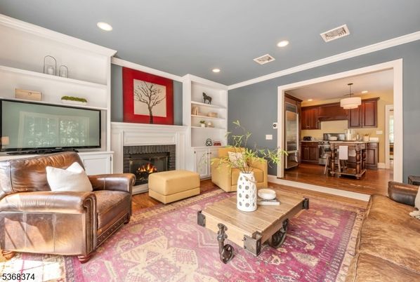 Dining room, Fireplace, Interior, Kitchen, Living room, Pendant Lights, Recessed Lighting, Stainless Steel Appliances, Wood Texture Flooring