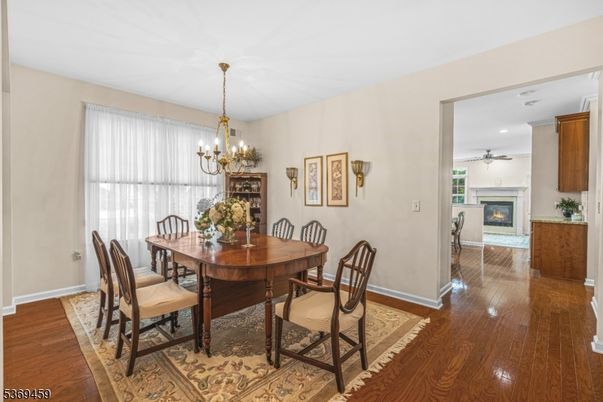 Chandelier, Dining room, Fireplace, Interior, Recessed Lighting, Wood Texture Flooring