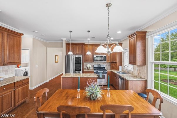 Dining room, Interior, Kitchen, Pendant Lights, Recessed Lighting, Stainless Steel Appliances, Wood Texture Flooring