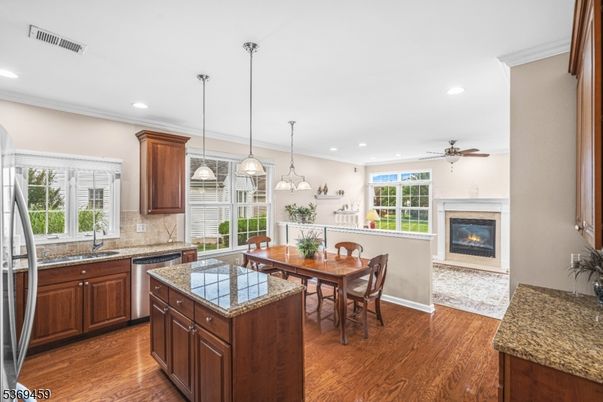Dining room, Fireplace, Interior, Kitchen, Pendant Lights, Recessed Lighting, Wood Texture Flooring